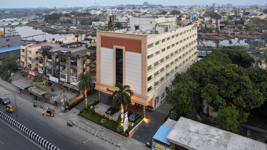 Aerial side view of the hotel surrounded by the cityscape at Hotel Royal Regency Chennai