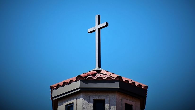 The Holy Cross located above a Church building