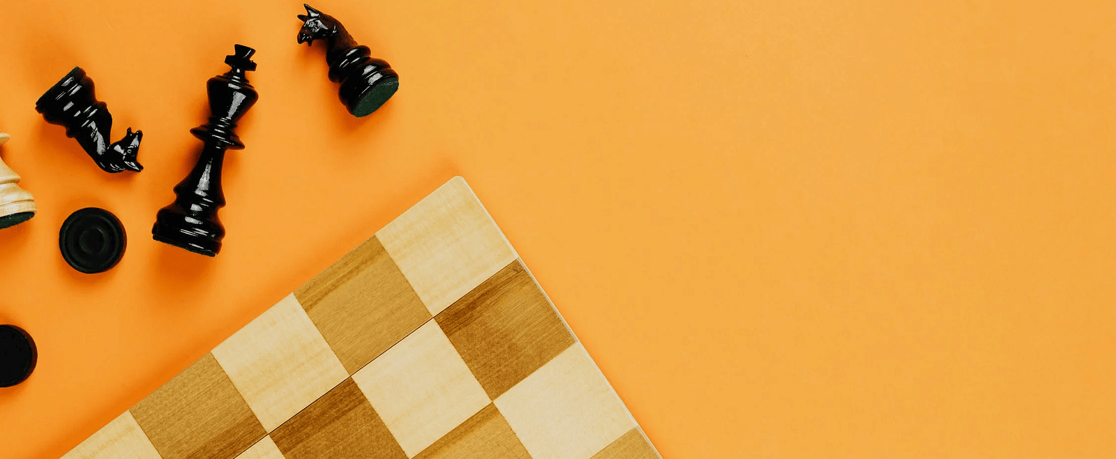 An image of a chessboard on an orange background.