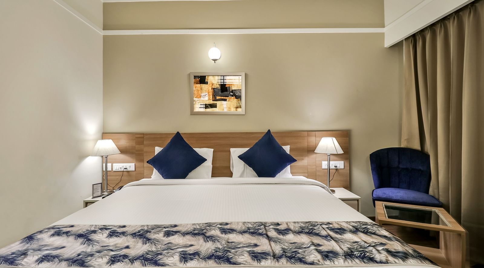 A double bed inside Deluxe Suite - Starlit Suites Newtown, Kolkata