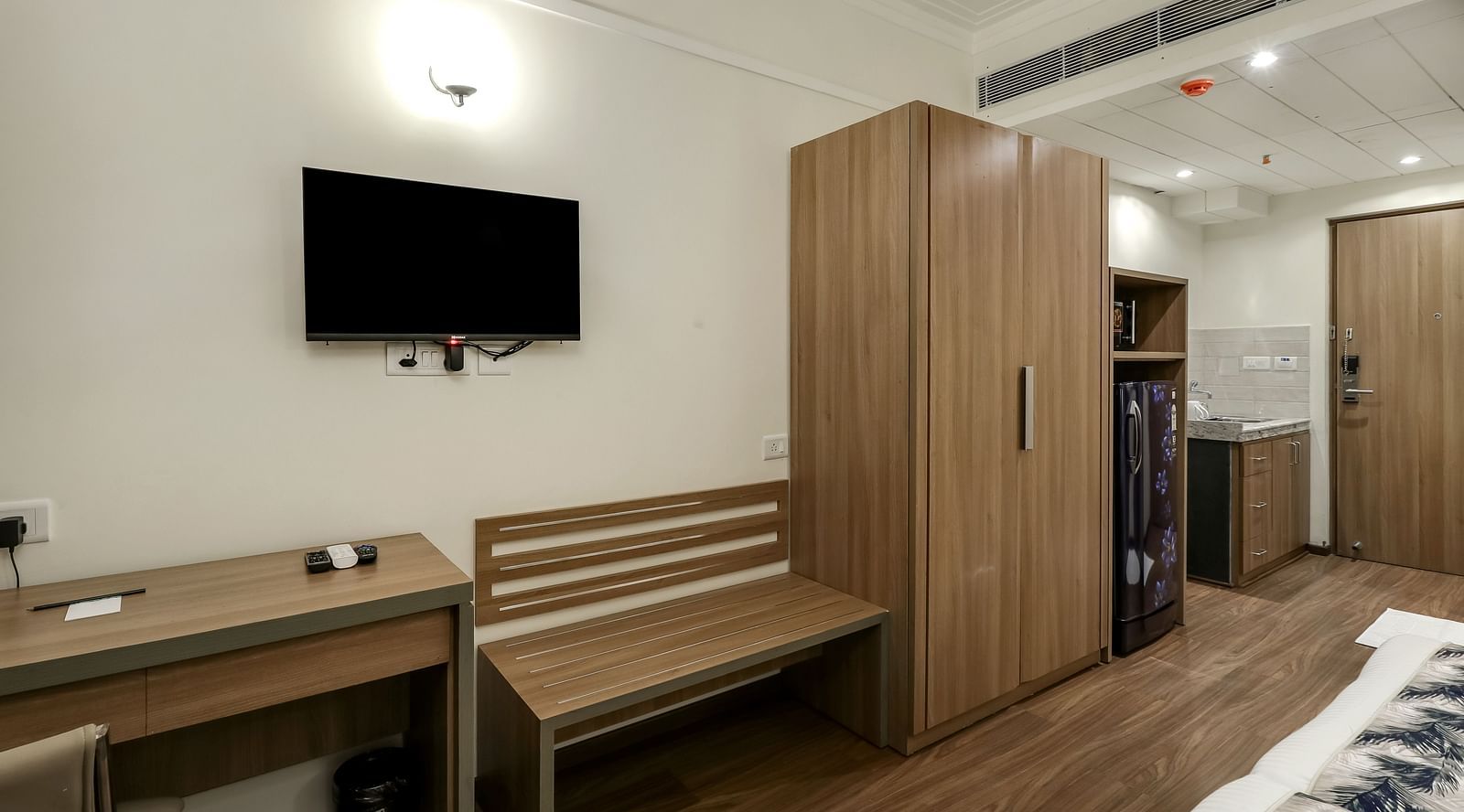 Close up shot of a tv wall mounted inside Premium Studio - Starlit Suites Newtown, Kolkata