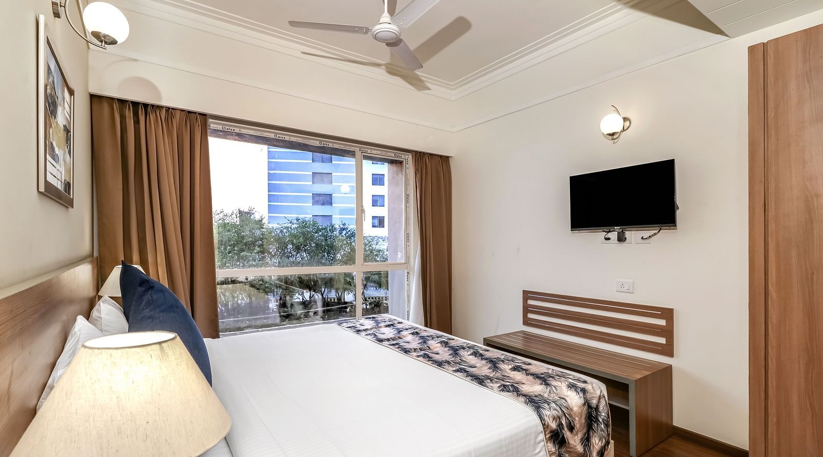 a double bed inside Premium Studio - Starlit Suites Newtown, Kolkata
