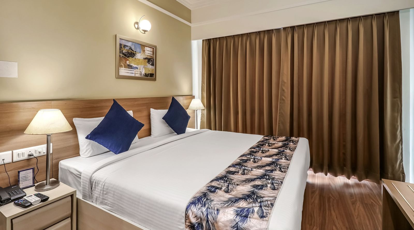 a double bed inside Premium Studio - Starlit Suites Newtown, Kolkata