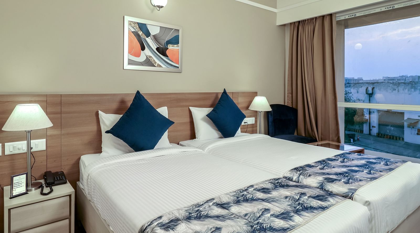 twin beds inside Premium studio - Starlit Suites Newtown, Kolkata
