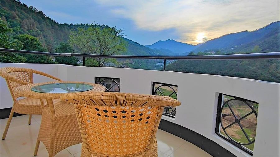 Balcony view of the mountains amidst which the sun is rising