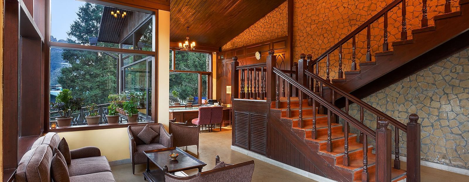 Hotel lobby featuring a staircase leading to the upstairs.