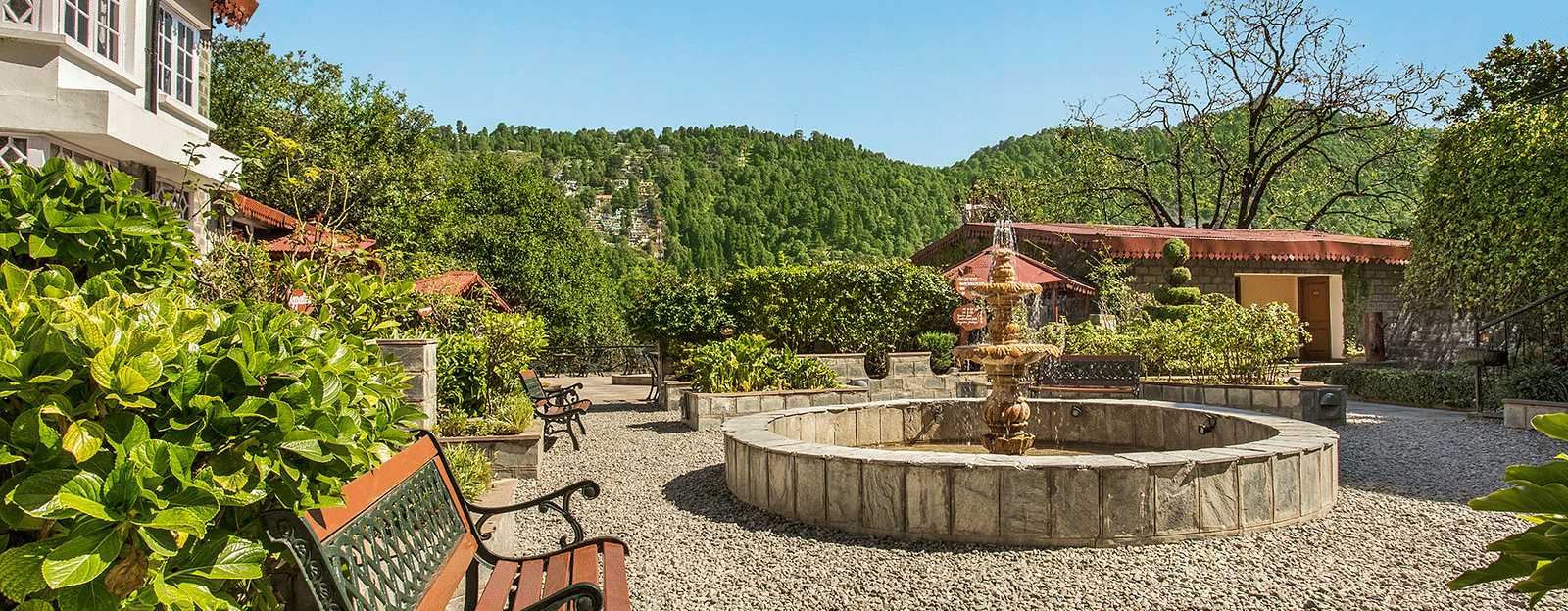 Courtyard with seating area and fountain at The Riverview Retreat, Corbett.