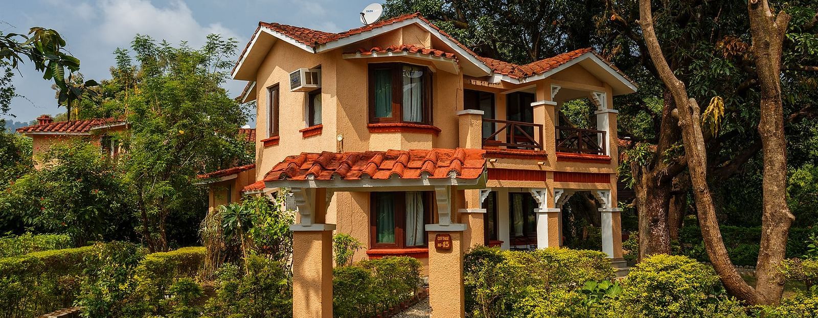 An image of a villa with many rooms and cottages amidst the trees - The Riverview Retreat,  Corbett