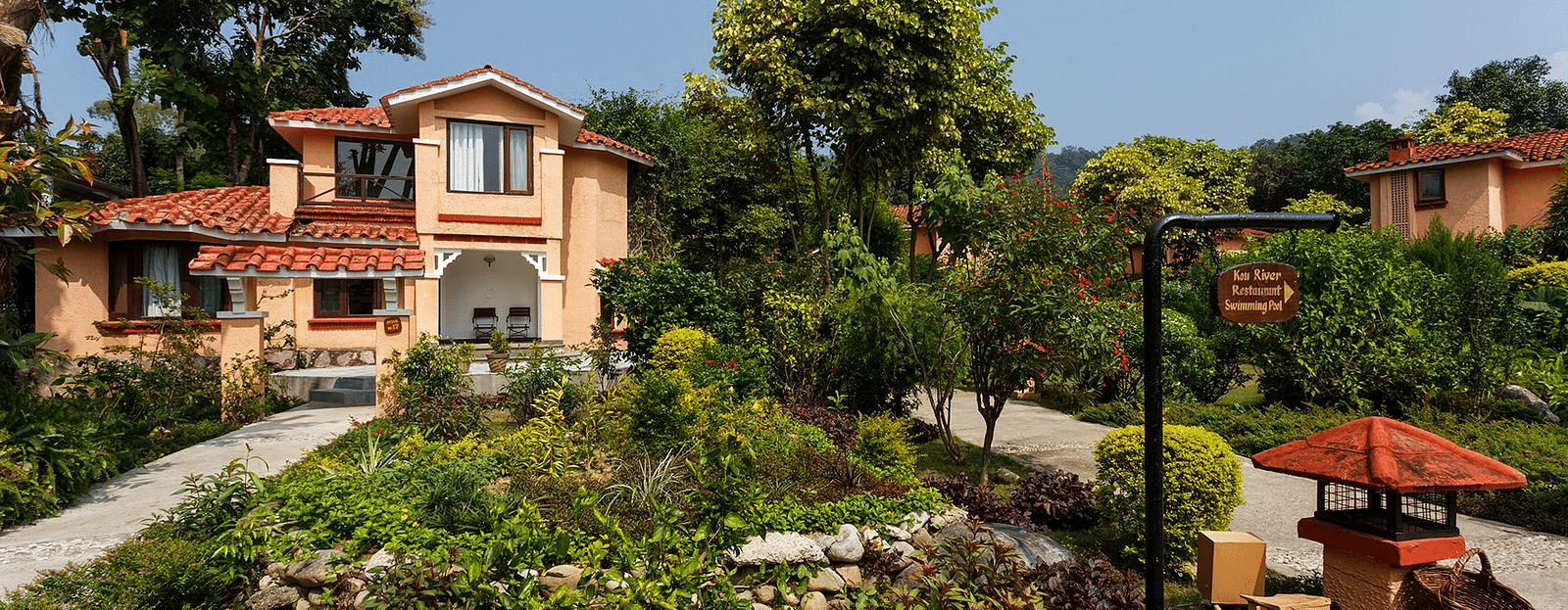 An image of a villa with many rooms and cottages amidst the trees - The Riverview Retreat,  Corbett qu2h5v