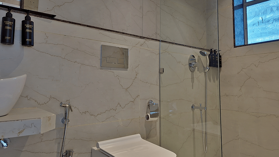 washroom with glass door and modern interior.
