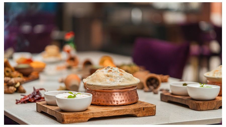 A table filled with various delicious dishes served to guests at Crescent Spa & Resort, Indore