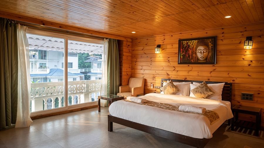 The classy wooden interiors of the Premium Cottage - Stone Wood Riverfront Resort, Siolim