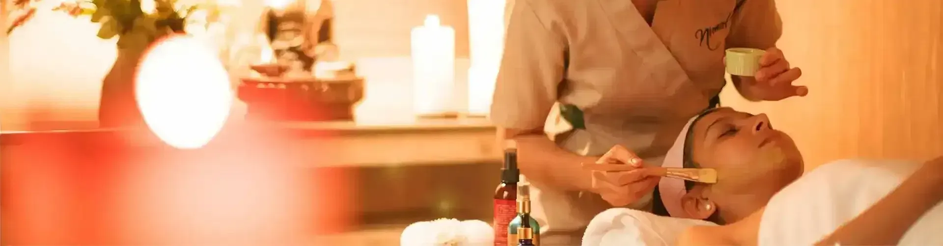 A woman laying at a spa bed at Karma Chalets.