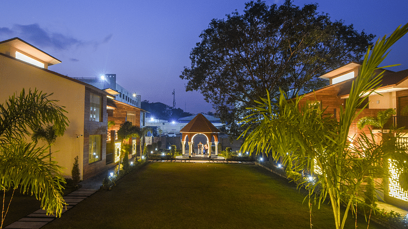 The Villa Exterior surrounds other villas amid a picturesque landscape - Wedlock Greens Hotel Resorts Dhanbad