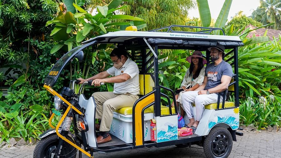 guests in a battery e-rickshaw