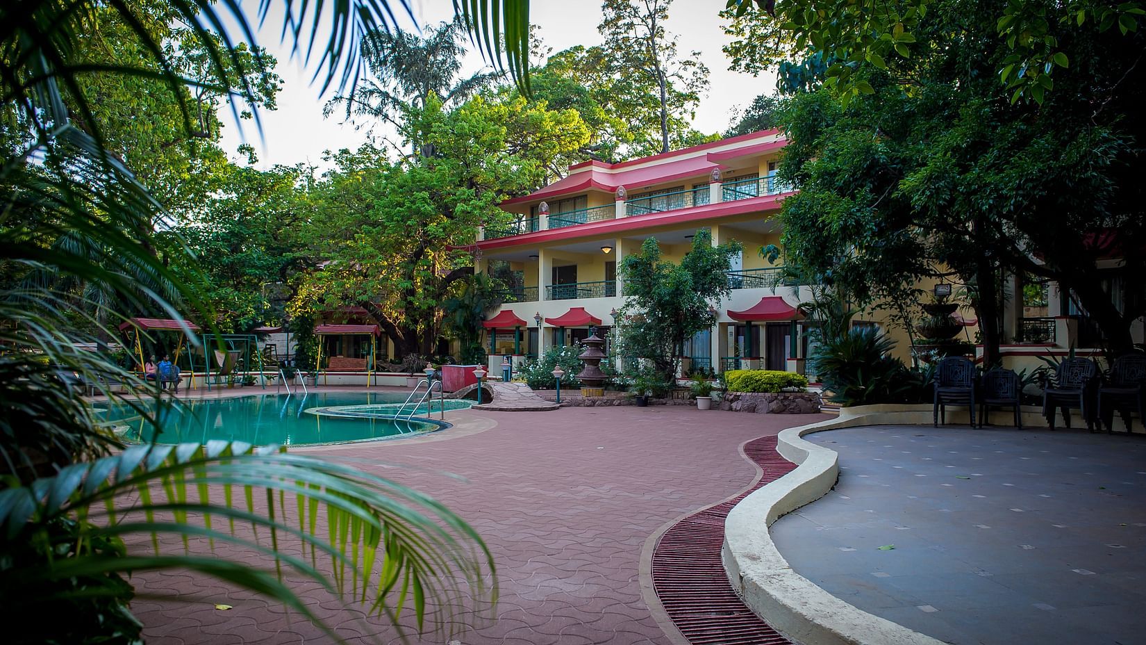 Adamo Resort Matheran - Exterior of the hotel amidst lush greenery