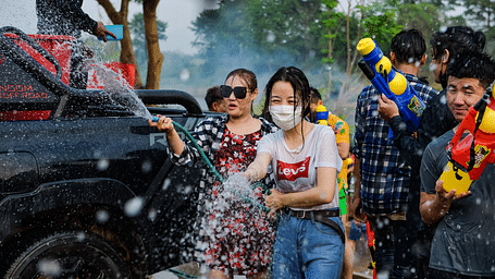 A group of people playing with water during Siam Songkran Festival in Bangkok.