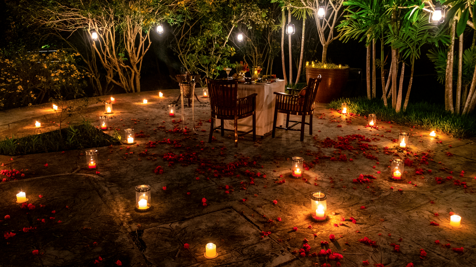 Romantic candlelight dining experience set amidst the forest at The Serai Bandipur.