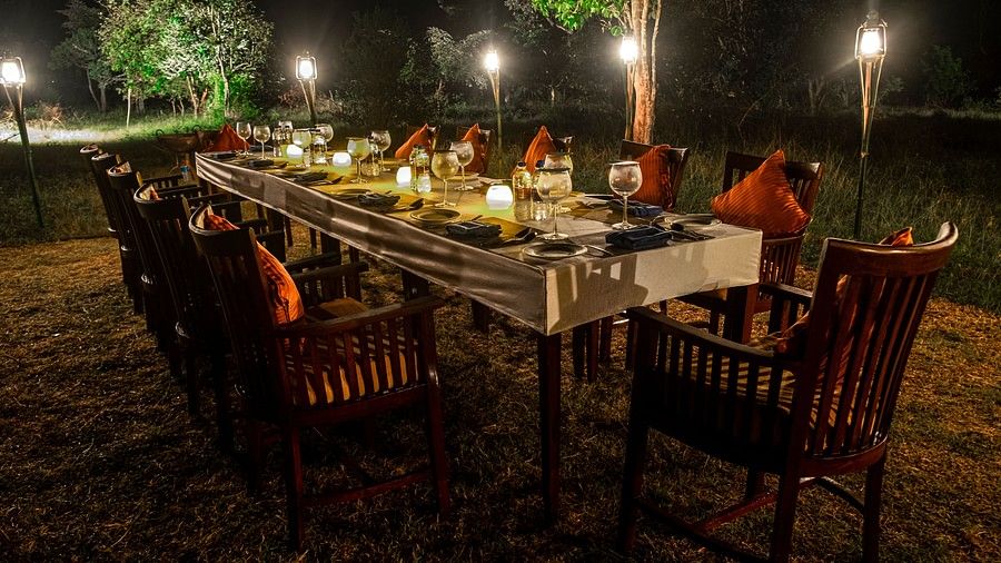 outdoor dinner party setup at The Serai Bandipur