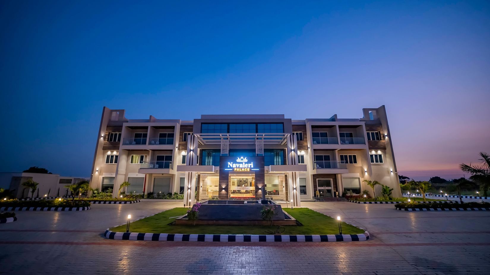 A wide-angle shot of the facade of Hotel Kyriad Prestige, Ilkal at night