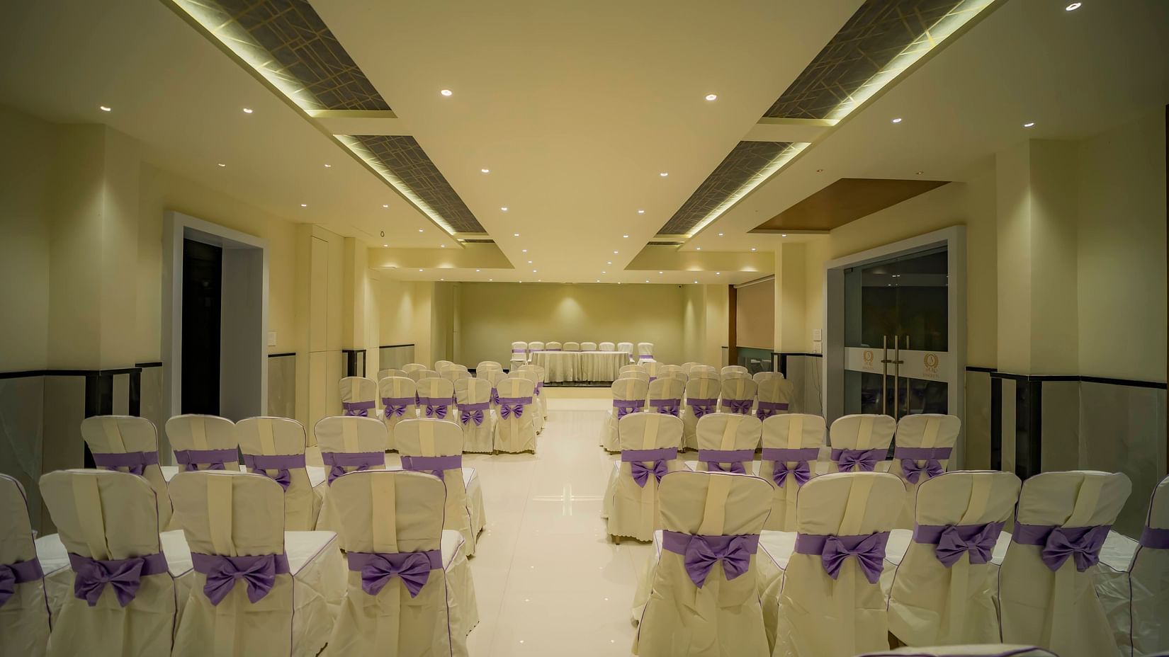 A back view of classroom seating of empty chairs at the best banquet hall in Karnataka