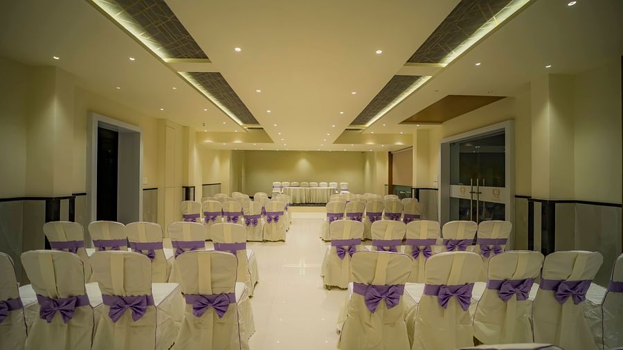 A back view of classroom seating of empty chairs at the best banquet hall in Karnataka