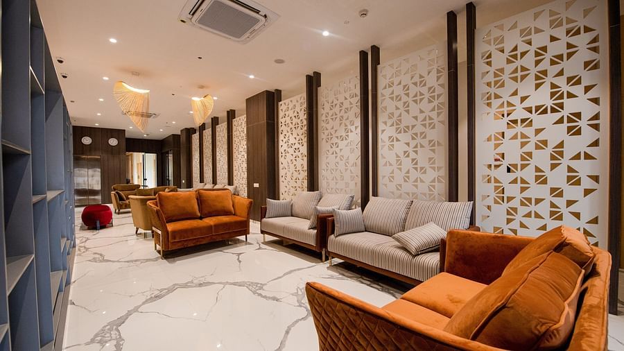 lavish lobby area with marbled floor and couches with air-conditioning on the ceiling - Mastiff Hotel, Ankleshwar2