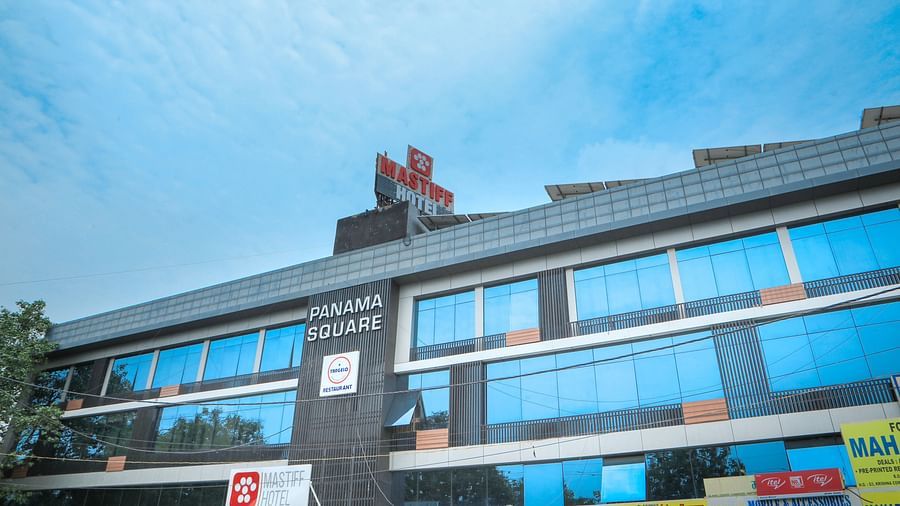 facade of a hotel building with blue sky as the  backdrop - Mastiff Hotel, Ankleshwar