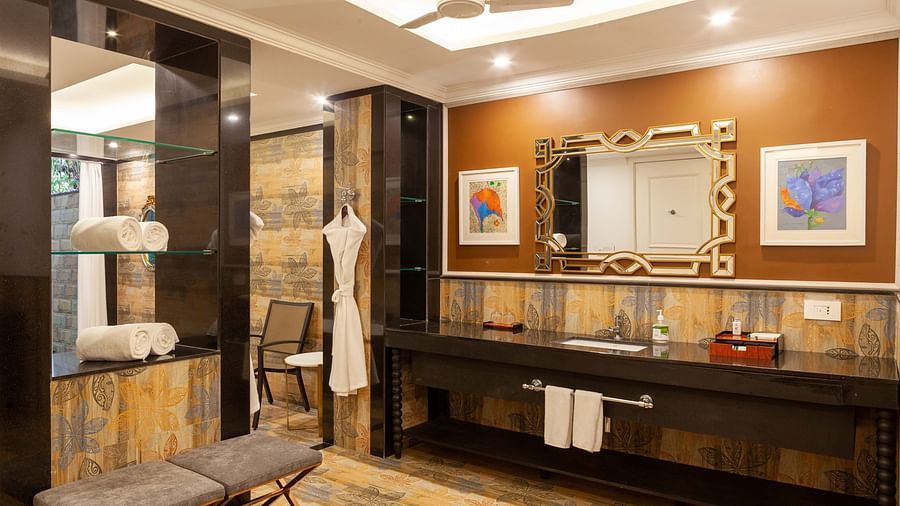 the bathroom offering bathrobes and towels - Mayfair Lake Resort, Raipur 3