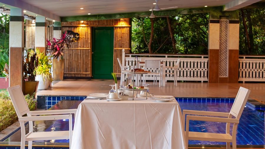 seating arrangement by the pool - Mayfair Lake Resort, Raipur