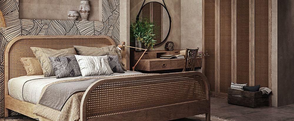 A spacious room featuring a large bed and a wall-mounted cupboard to the side at The Evren, Vagator.