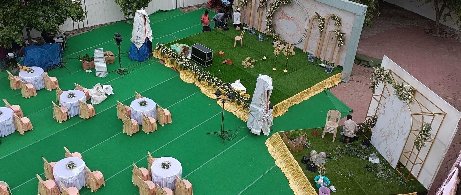 An aerial shot of Starlight Garden, our thoothukudi marriage hall, featuring round tables with chairs placed around them - Regency Tuticorin by GRT Hotels
