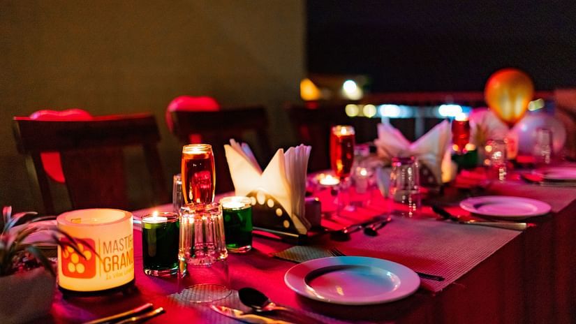Table setup with detailed place settings and décor, ideal for a festive dining experience - Mastiff Grand La Villae Resort, Lonavala