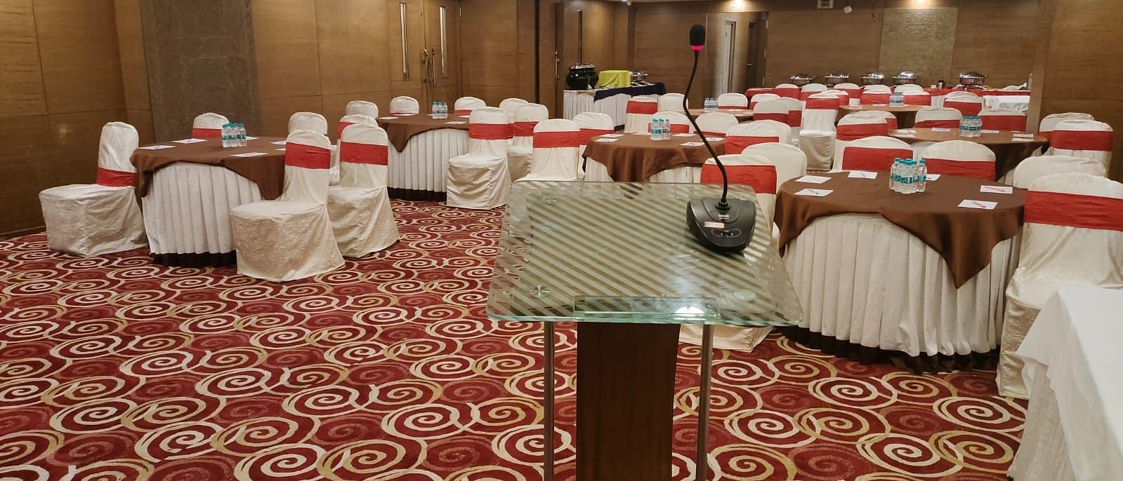 A spacious and elegant hotel room with a flat-screen TV and a welcoming ambience at The President Hotel Jayanagar, Bangalore