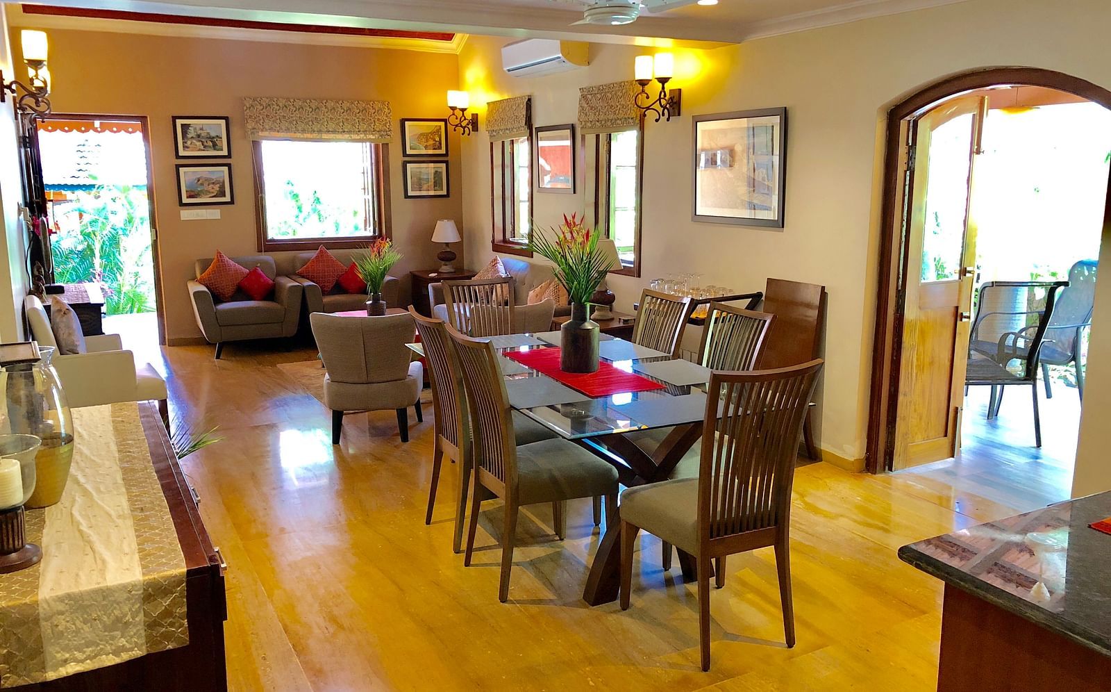 Living Area featuring a six-seater dining table behind which sofa sets are arranged