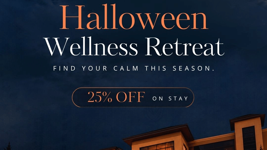 Halloween Wellness Retreat at YO1 Longevity & Health Resorts - the resort entrance lit up at night with carved pumpkins and autumn trees, with a 25% off on stay offer