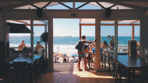 Cafe by the beach with people