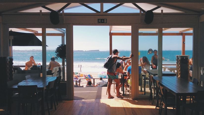 Cafe by the beach with people