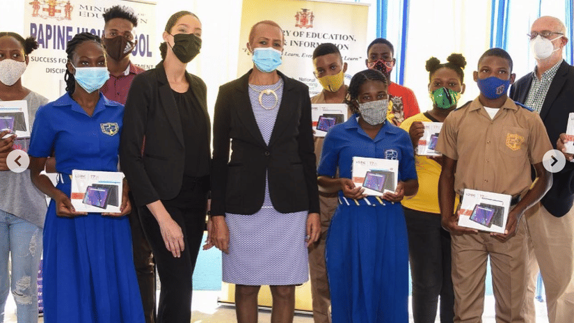 Group photo of S Hotel Foundation members standing alongside school students and teachers, highlighting the foundation’s support for youth education and development programmes in Jamaica.