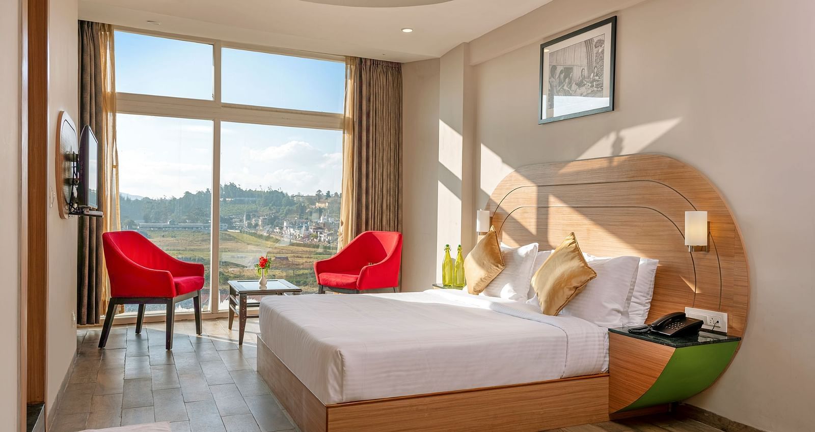 An image of a bedoom where natural light is seeping in through the glass window | Mango HIll Central, Ooty