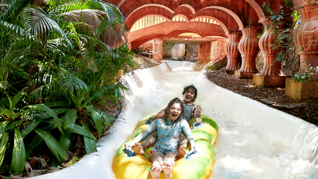 A man and a lady enjoying the Adventure Amazonia ride on a tube at Water Kingdom, one of the best places in Mumbai for couples for one day.