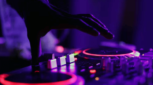 A close up shot of a turntable of a DJ using to play music at a party.