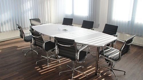 A spacious meeting room with comfortable chairs - VITS The Somnath Gateway
