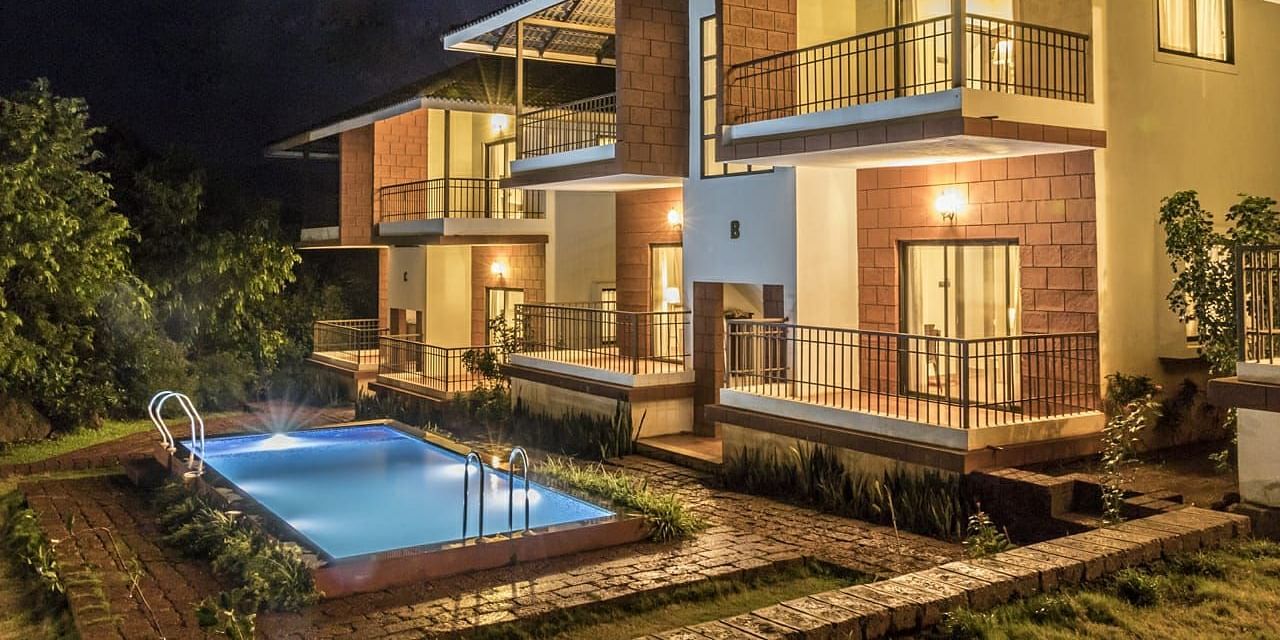  The resort is surrounded by greenery, with trees and shrubs visible in the background, suggesting a natural setting.