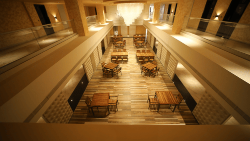 overview of VITS Bharat Nanded Atrium with chairs and tables in view - VITS Hotels & Resorts