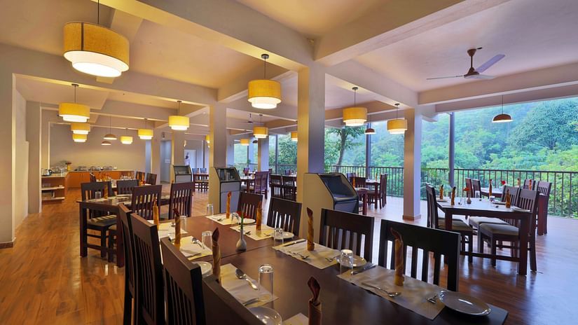 An overview of the seating arrangement inside the restaurant - Abad Brookside Lakkidi, Wayanad