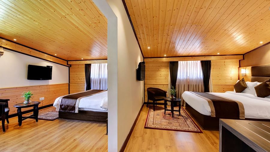 Queen beds in either side of the wall inside Attic family room - Sumitel Shangrila, Deorali