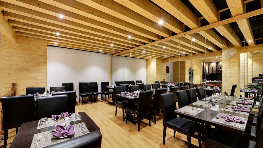 overview of the seating arrangements inside blue charcoal Restaurant - Sumitel Shangrila, Deorali