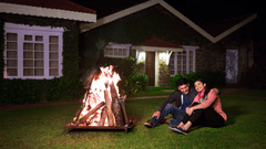 a couple in front of a bonfire 398298