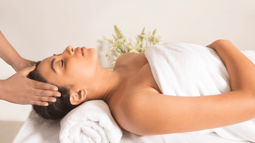 a person receiving a massage at the Spa at The Carlton 3